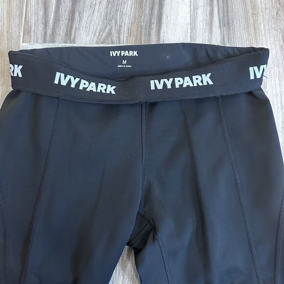 IVY PARK Leggings Sz M black Logo Waist pull on athletic Gym Capri Biker Pockets - Picture 4 of 6